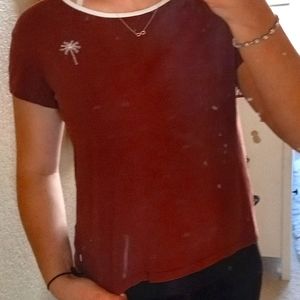 burgundy t shirt w logo on back and small on front